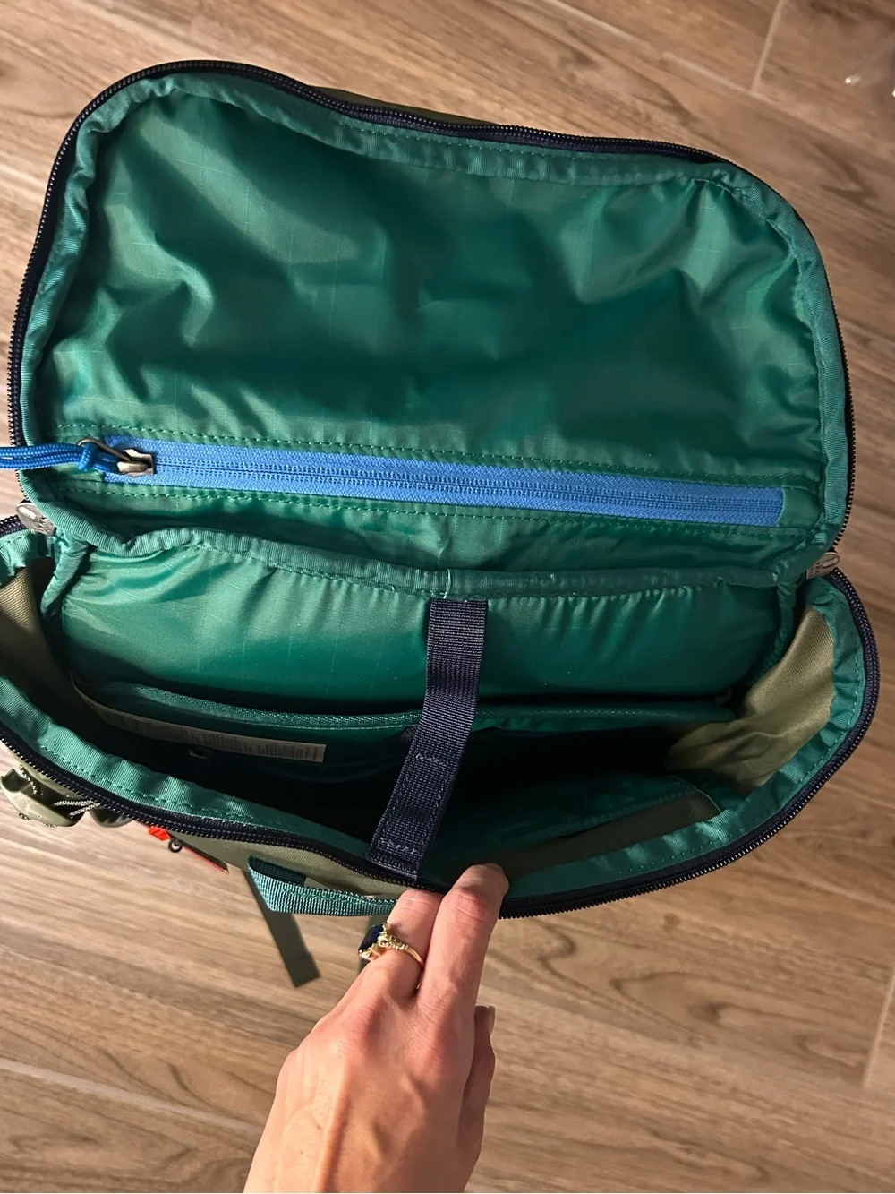 cotopaxi Olive Green Backpack with Blue and Teal Accents